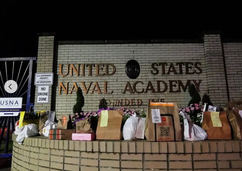 One person was injured as U.S. Naval Academy officials cleared the building following a report of a threat.